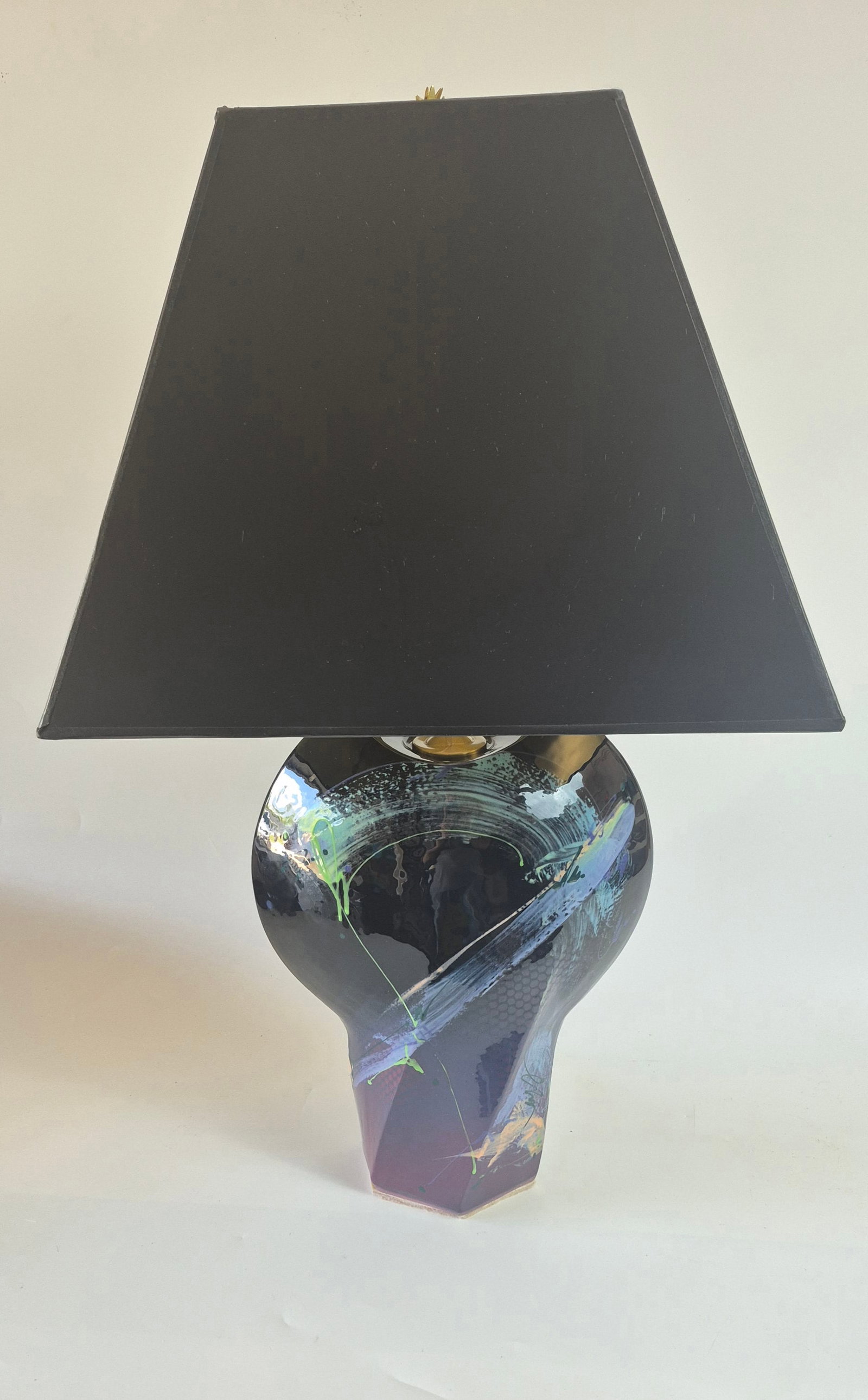 Vintage Handmade-Painted Abstract Ceramic Table Lamp @1980a: Stunning 1980s vintage ceramic table lamp. A unique, handmade piece featuring an abstract, hand-painted design in vibrant hues of pink, purple, and black, accented with delicate swirls and splashes of
