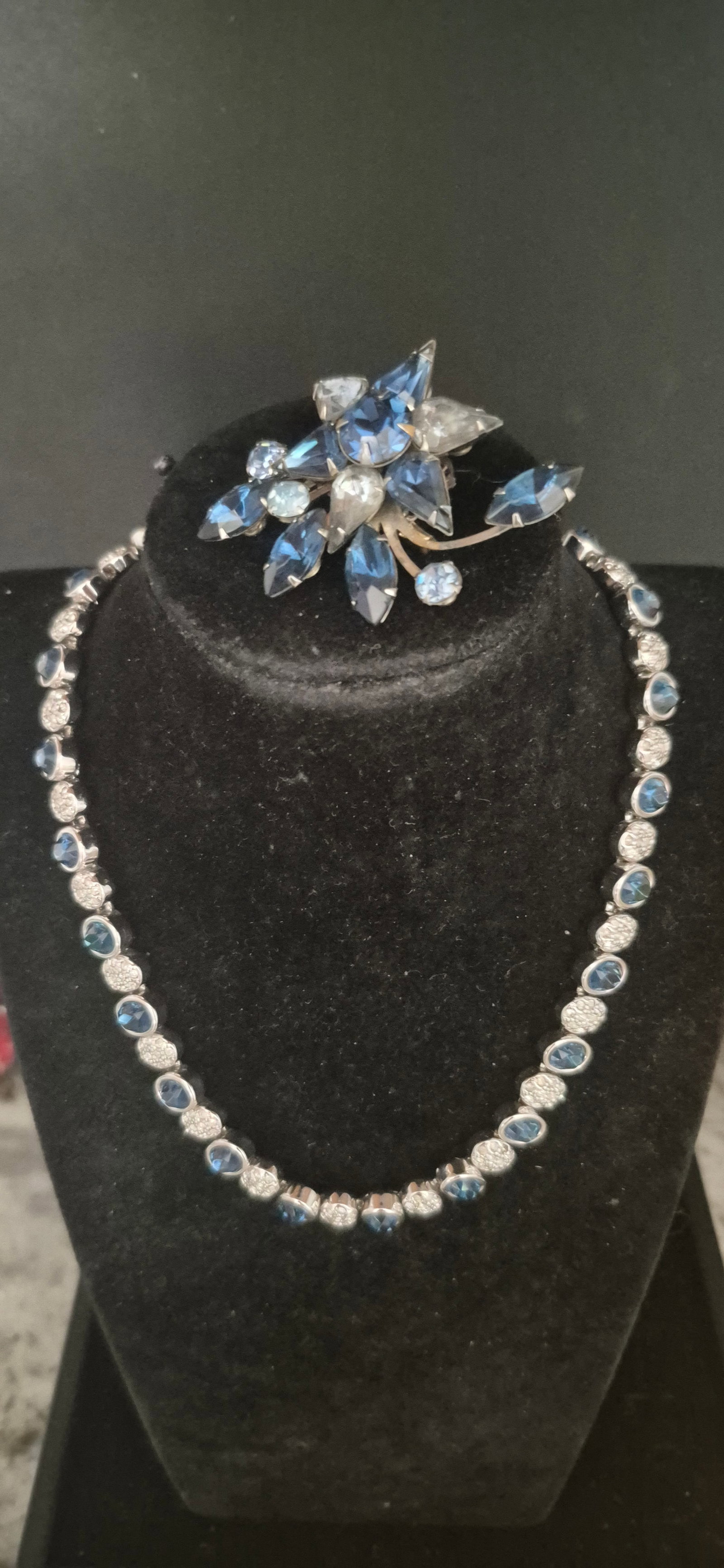 Faceted Sapphire Blue & clear Rhinestone Choker & Brooch set: Faceted Sapphire Blue & clear Rhinestone Choker & Brooch set Choker is rhodium plated with sapphire and rhinestone alternating Size: 14" closed / 28" length Brooch is random shaped , pin perfect