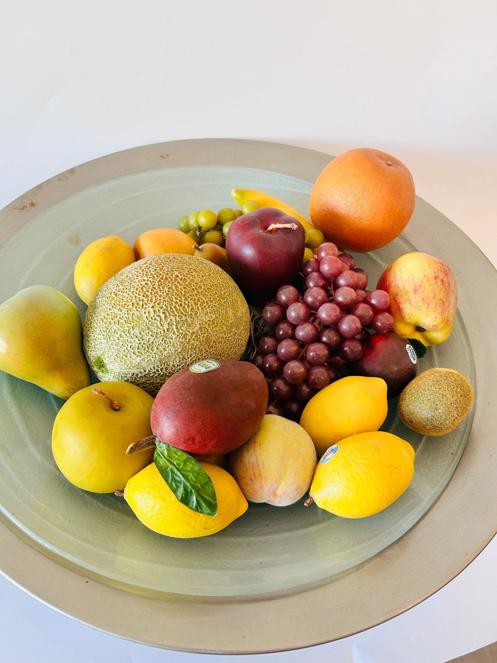 large Console Bowl realistic w/faux fruit: In-house shipping available please email longlakeart@gmail.com. large Console Bowl realistic w/faux fruit. Metal bowl with glass liner sits on 3 globes. Measures 22 D x 7 H in inches
