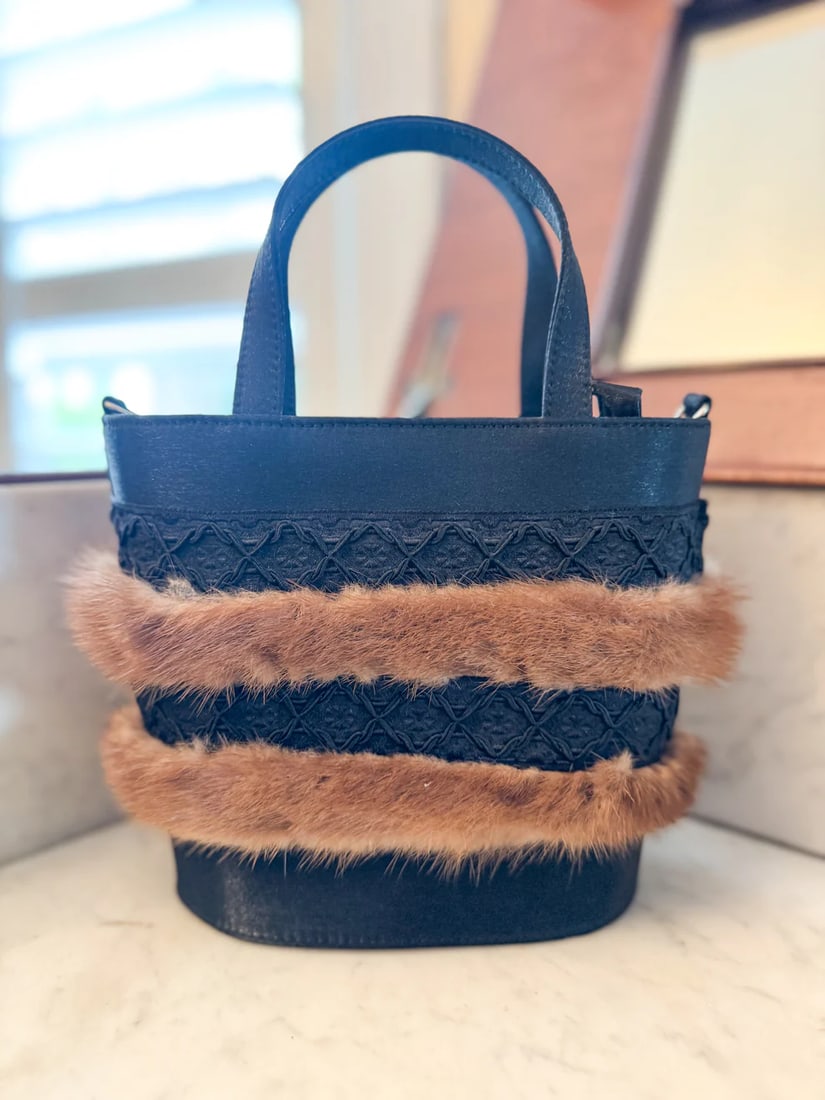 vintage CAPAF Made In Italy handbag: This gorgeous vintage CAPAF Made In Italy handbag is a one-of-a-kind piece featuring a unique basketweave design made of fur and suede. The bag has a snap closure and double handles made of multiple s