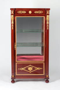 Empire Display Cabinet, 19th century: Desk cabinet adorned with ormolu bronze , 19th century. Empire, Europe . Mahogany wood (solid and veneer) and bronze (casting, chiseling, gilding). It features two glass and one wooden shelf, faceted