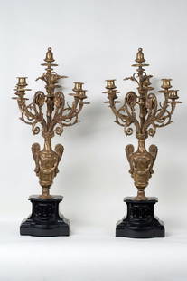 Pair of Bronze Candelabra, 19th century: Lot of a pair of candelabra, each holding 5 candles, 19th-20th century. Classicism. Bronze and black marble. Candelabra's height 73 cm (28 3/4 inches) dimensions 20 x 12 cm (7 3/4 x 4 3/4 inches).