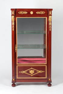 Empire Display Cabinet , 19th century: Desk cabinet adorned with ormolu bronze, 19th century. Empire, Europe. Mahogany wood (solid and veneer) and bronze (casting, chiseling, gilding). It features two glass and one wooden shelf, faceted