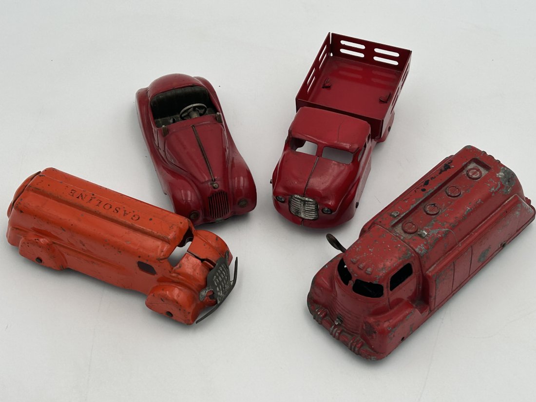 Vintage circa 1930s-40s pressed steel toy cars including Schuco and Wyandotte: 4 cars in total, dating to the 1930s-1940s. Includes a Wyandotte stake bed pick up and Schuco Examico, circa 1947. All are pressed-steel, with original paint. Longest car 6.625"