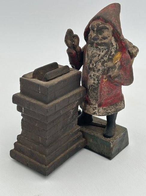 RARE antique 1889 SHEPARD HARDWARE 'Santa at the Chimney' Cast Iron Maechanical Bank: A rarely seen example, manufactured by SHEPARD HARDWARE in 1889. A mechanical mechanism drops the 'gift' down the chimney, via Santa's hand. One of the screws on the bottom a likely replacement, but o