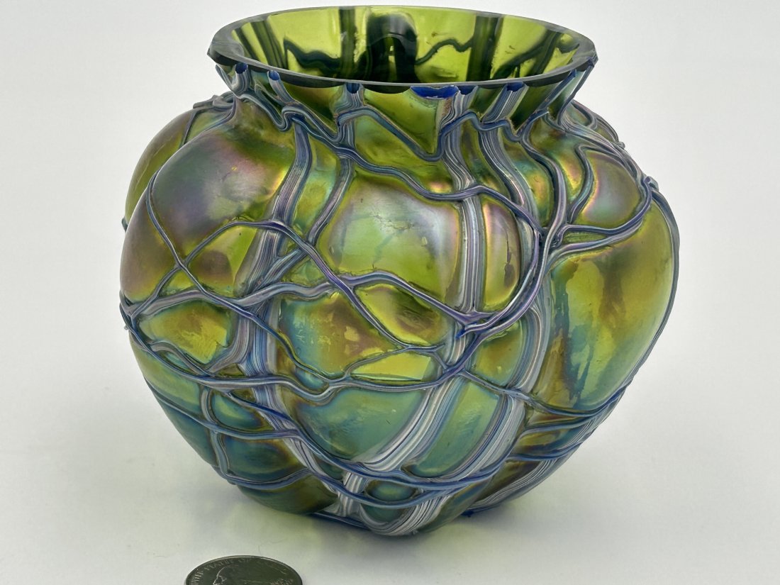 Antique circa 1905 LOETZ Art Glass Vase: Bulbous, squat form in green iridescent finish, with an applied cobweb of of amethyst decoration. Condition is excellent. 5.25" in diameter.