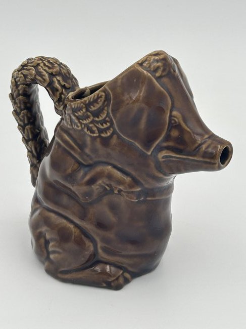 Antique Majolica Figural Pig Pitcher: Excellent condition, from the 1st quarter of the 20th century. Brown glazed pig with leaf handle.