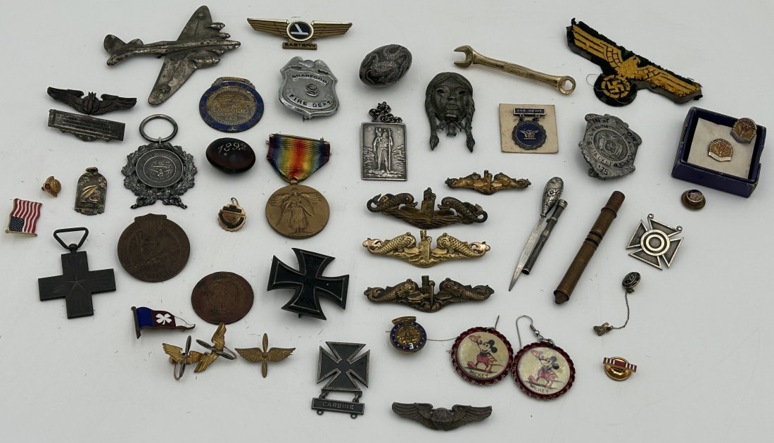 Substantial Pinback, Button, and Medal Lot- Advertising, Service and Military: A large lot, which includes many items of interest. Included are 8K and 10K solid gold Winchester service pins, Japanese silver ojime bead, WW2 submarine crew pinbacks, Navy Department silver medal, b