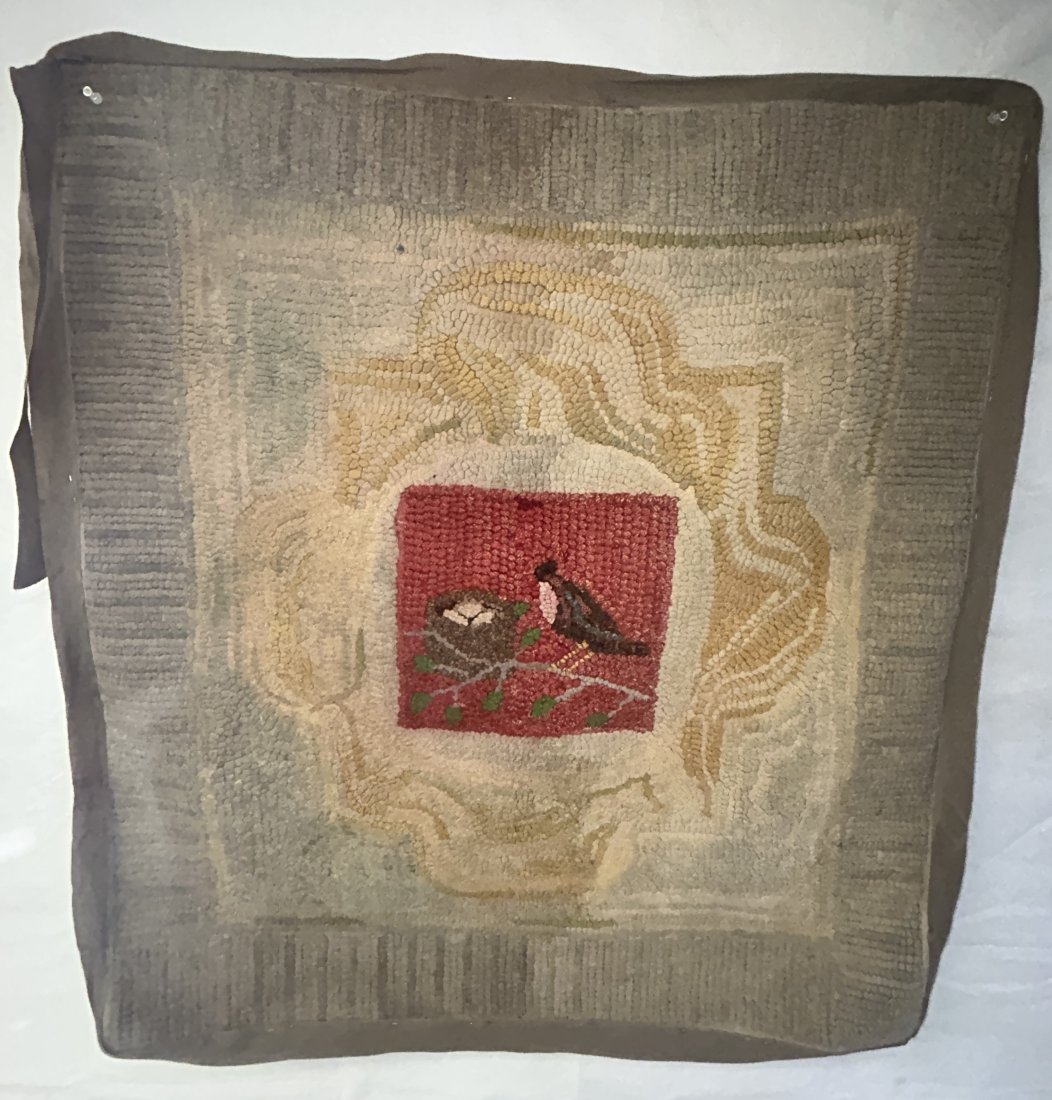 Antique 19th Century Folk Art Hooked Rug with Robin's Nest Motif: A fine example, dating to the 19th century, centered by a nesting Robin in tree. Measures 32" by 36"