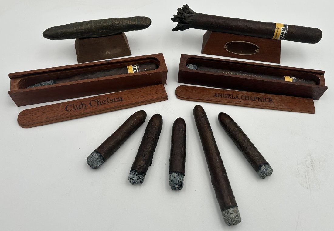 Large Grouping of 9 Original Darrel Chapnick Bronze Cigar Sculptures: Darrel Chapnick is best known as a fine Connecticut maker of figural woodworking planes, including robots and Native American Chiefs. He cast this large group of figural solid bronze cigar sculptures 