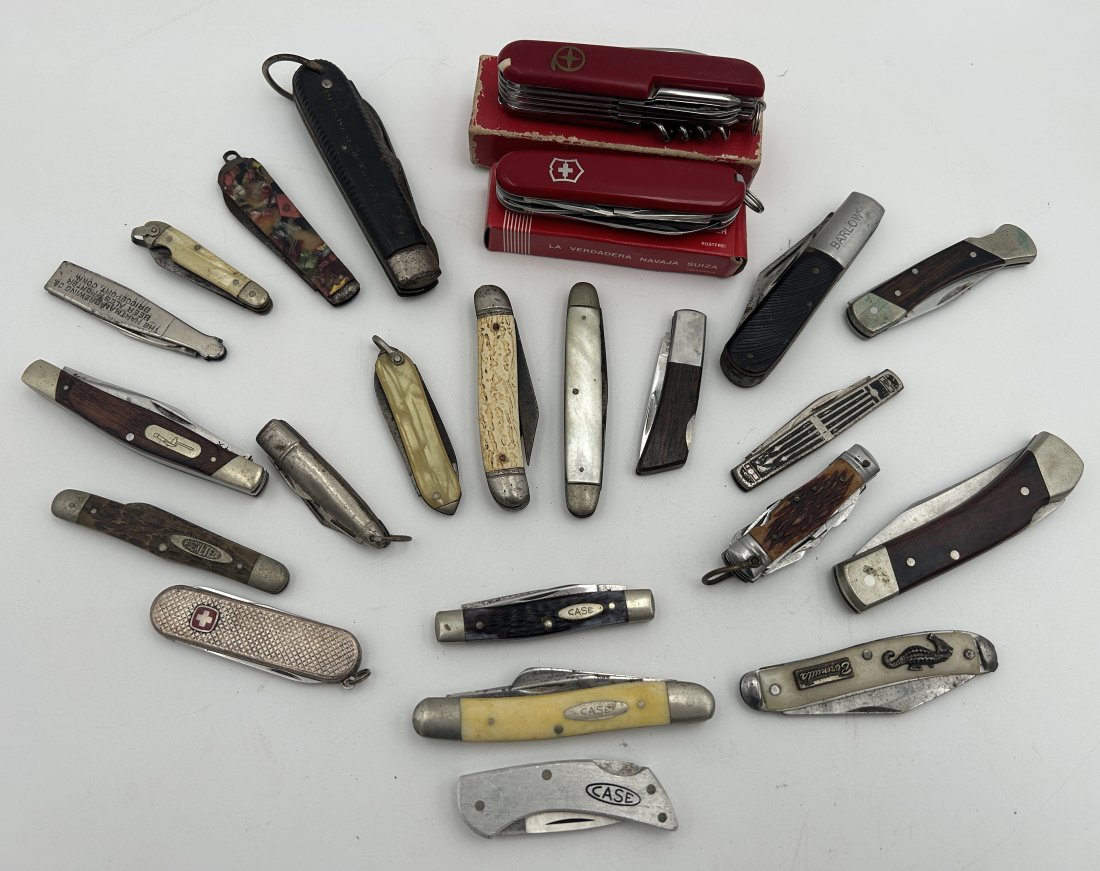 23 Vintage and Antique Folding/ Pocketknives: A large grouping, including Case, Swiss Army, and a selection of early pocketknives, several advertising-related.