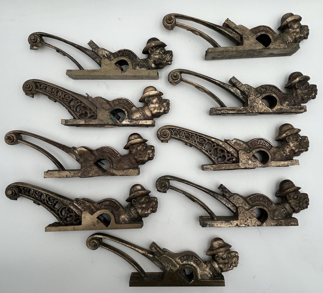 9 Darrell Chapnick Unfinished Bronze 'Bulldog' Woodworking Planes: They are part of the Chapnick estate, and show the artist's process. 9 'Bulldog' models, several varieties, in various states of completion. Solid bronze. 11" in length.