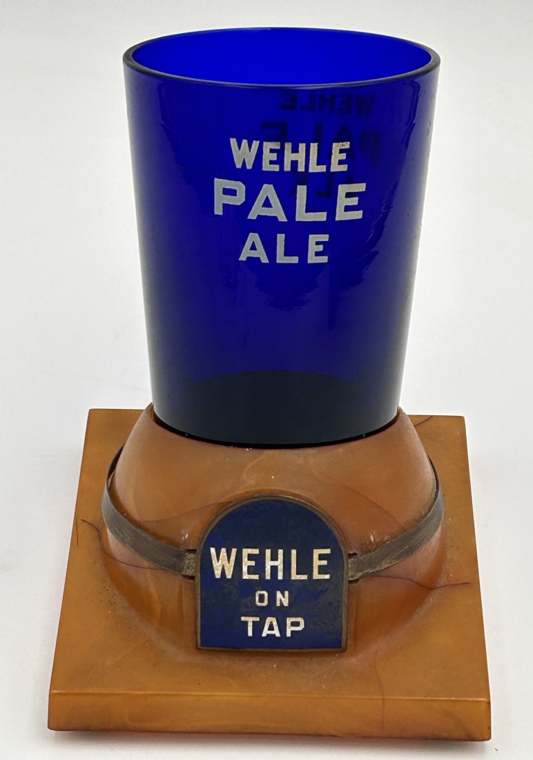 Art Deco Era Wehle Pale Ale Advertising Swizzle-Stick Holder with Bakelite Base: circa 1930s/40s, a bar top advertising display for WEHLE Pale Ale. Features a slanted butterscotch-Bakelite base and original cobalt blue glass pint glass, which would have held swizzle-sticks.