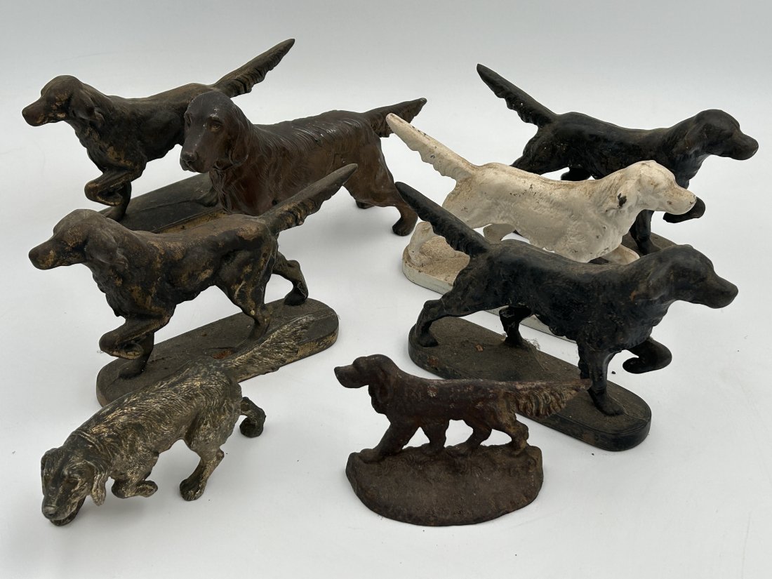 Dog Doorstops and Statues: All early vintage, solid cast iron. 8 in all. Largest example is 8" in length.