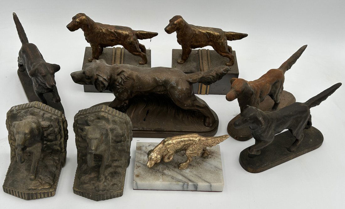 Dog Doorstops, Bookends and Figures: As shown, a mixed grouping of cast iron doorstops, pot metal figure, doorstops, and figure on marble base. Largest is 9.25" long.