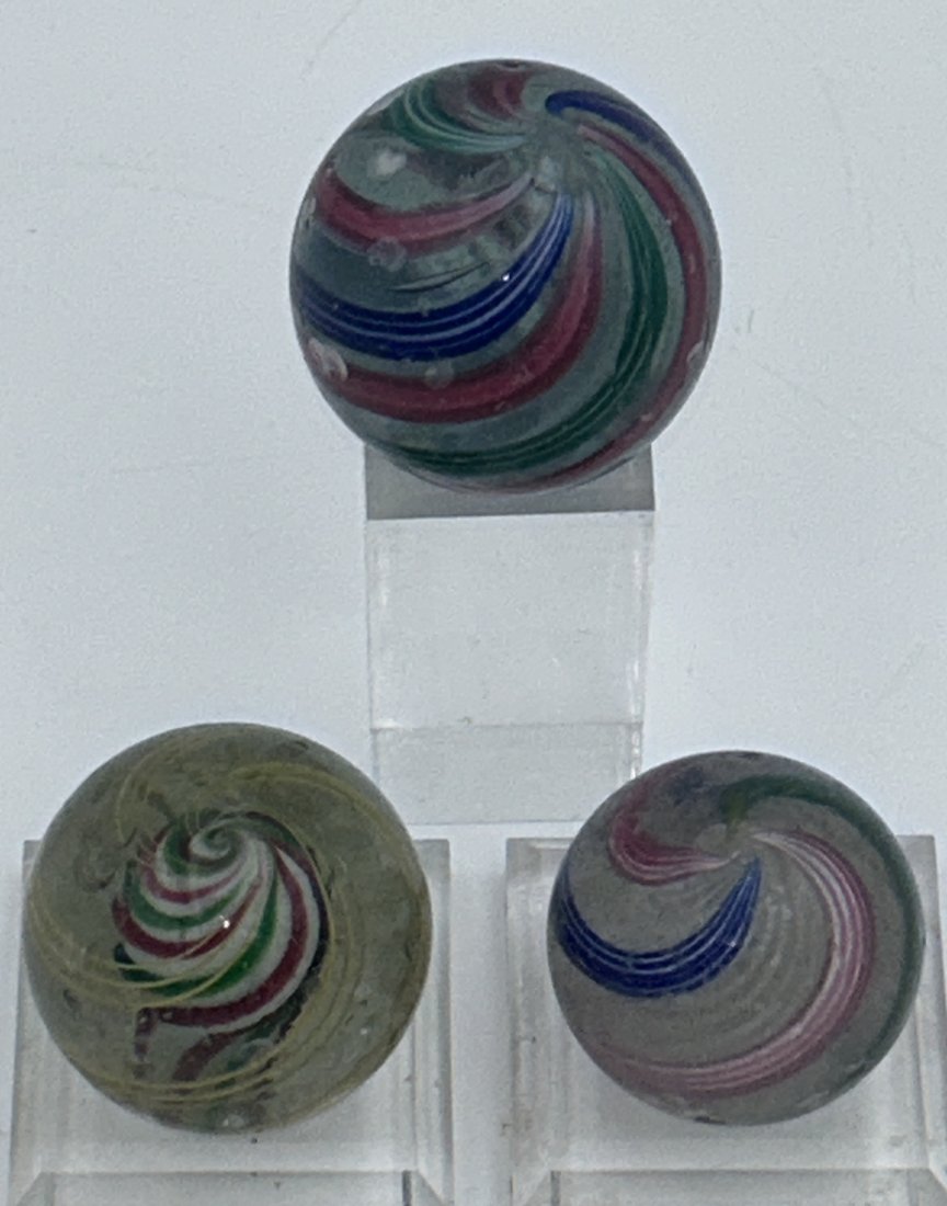 3 Antique 19th Century Hand-Blown German Marbles: All are hand-blown, with visible pontils. 3 large shooters, in good overall condition. Latttacino and 'End of Day' designs. Largest is just over 1.75" in diameter