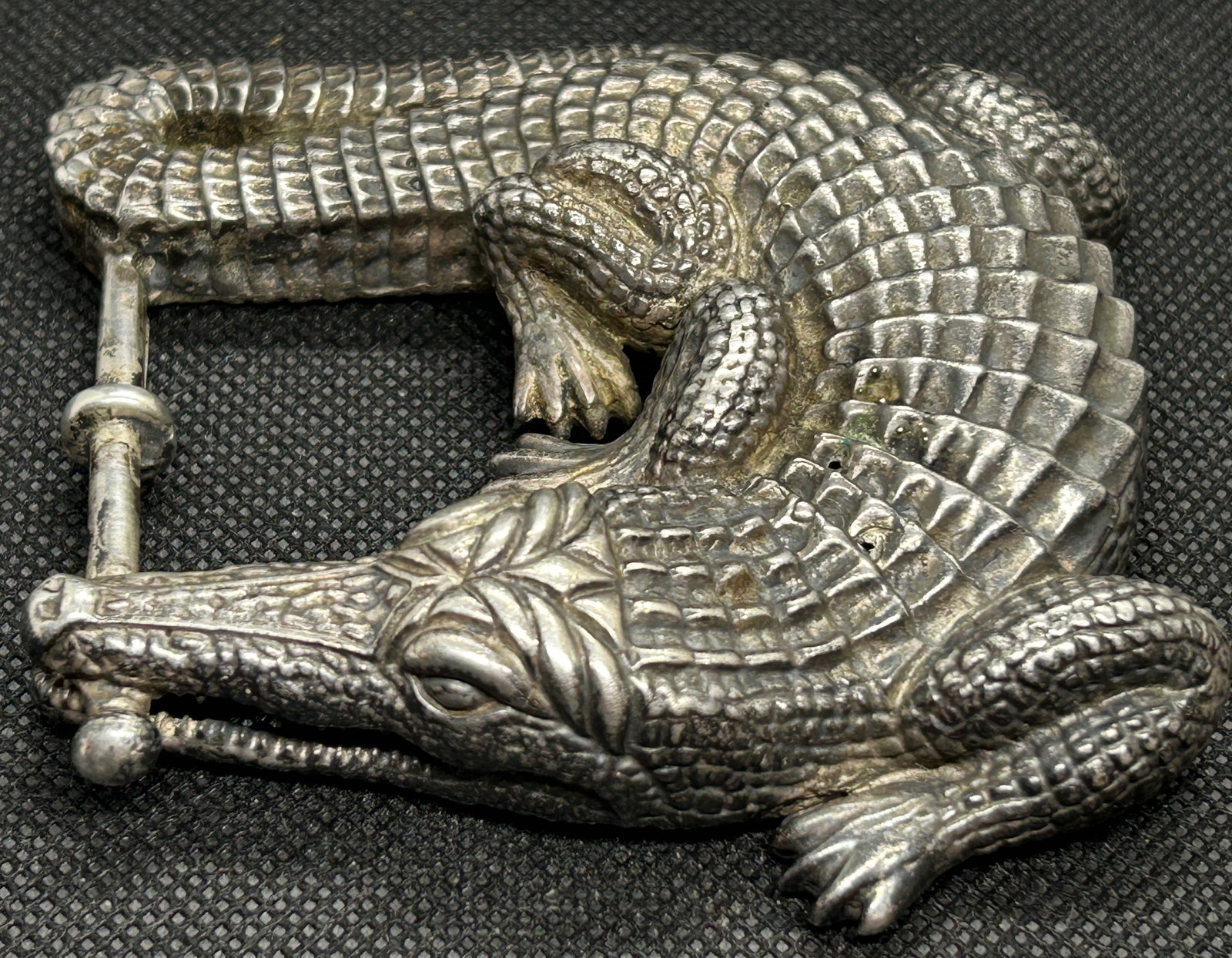 Vintage Modernist KIESELSTEIN-CORD Figural Sterling Silver Alligator Belt Buckle: A hefty and well-designed belt buckle by noted designer Kieselstein-Cord, first created in the mid-1970s. The alligator buckle is an iconic design, cast in Sterling silver, with a weight of 145.8 gram