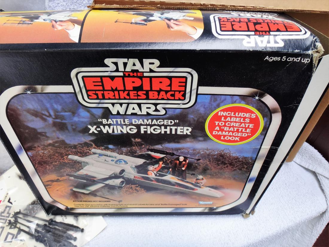 STAR WARS ESB, "BATTLE DAMAGED" X-WING FIGHTER: We are not experts and will not grade any of the Star War or other toys, trains and collectibles. Please look at pictures and ask questions. ALL items are AS IS and it is buyer's responsiblity to make