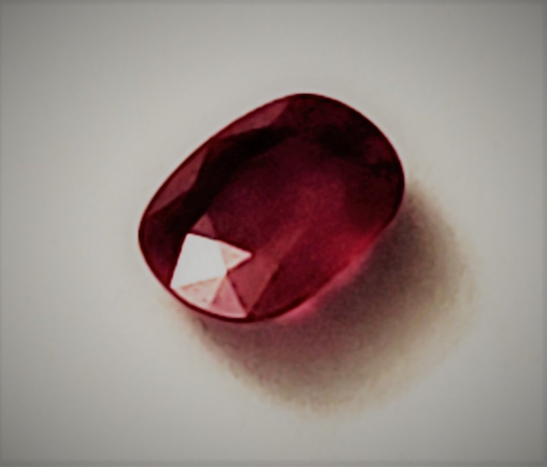 TWO LOOSE RUBY GEMSTONES, BOTH REMOVED FROM JEWELRY. (1 of 2)