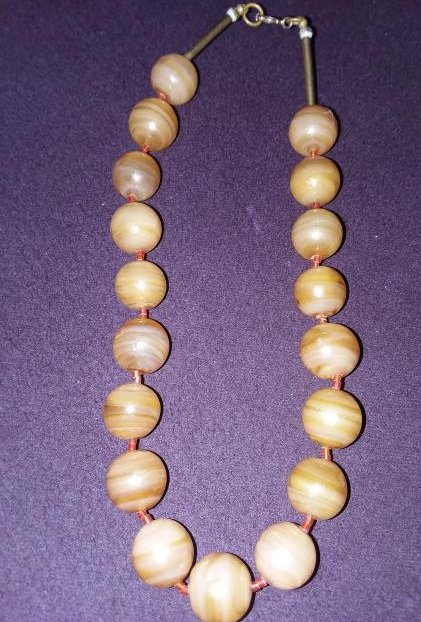 STRAND OF UNUSUAL YELLOWISH TONED BANDED CARNELIAN.: VINTAGE TO ANTIQUE, GUILT SILVER MOUNTED.