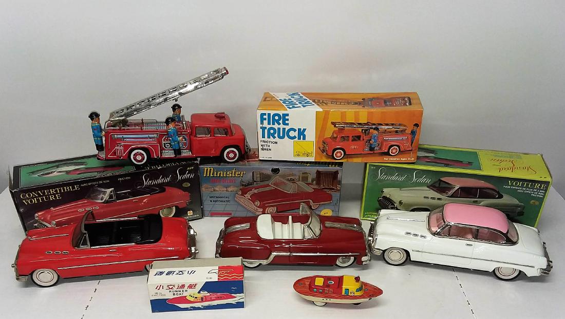 LOT OF 5 TIN VEHICLES WITH FRICTION AND SOME WITH: STANDARD SEDAN MINISTER OPEN DELUXE FIRE TRUCK CONVERTIBLE & FRICTION RUNNER BOAT.