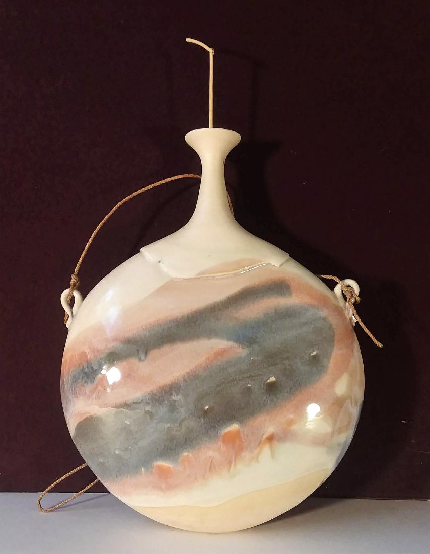 ELEGANT STUDIO POTTERY CANTINE/VASE.: CANTINE/FLASK STYLE, HAND-CRAFTED STUDIO POTTERY. WITH MULTI-COLOR SCENIC ARTWORK. GOOSENECK HANDLES W/ A TINY FLAKE AT THE TOP RIM. UNKNOWN ARTIST POTTER. DIMENSIONS: 9 1/2"x7 1/2"