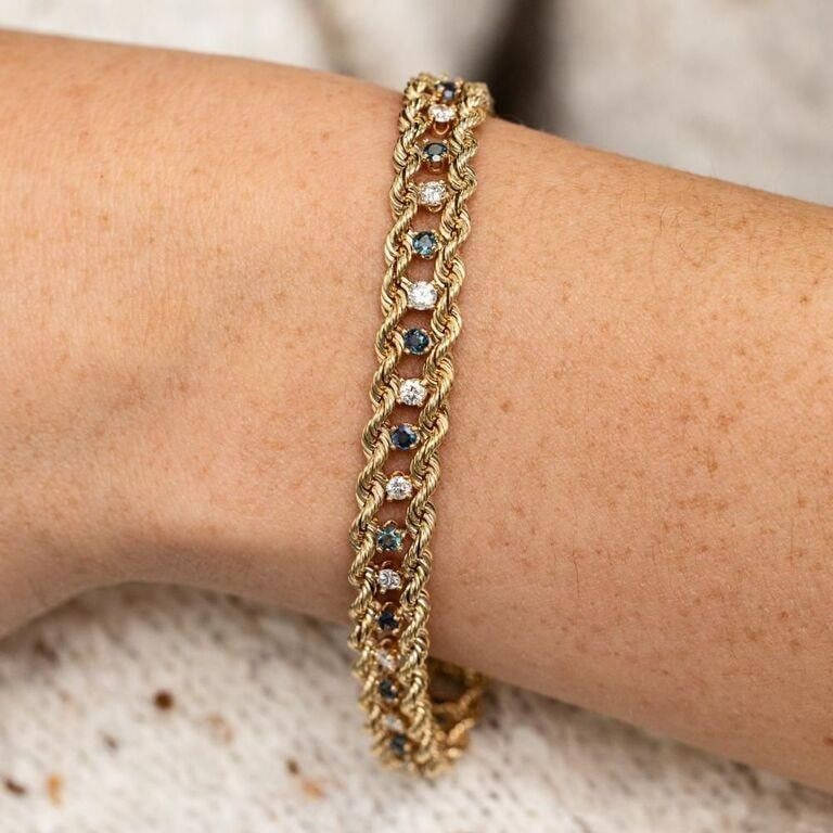 Vintage 14K Yellow Gold Diamond and Blue Sapphire Double Rope Bracelet: A beautifully made bracelet featuring 18 natural white diamonds and 18 natural blue sapphires. Both the sapphires and diamonds are round in shape. The stones are even in size at 2.5mm each giving the 