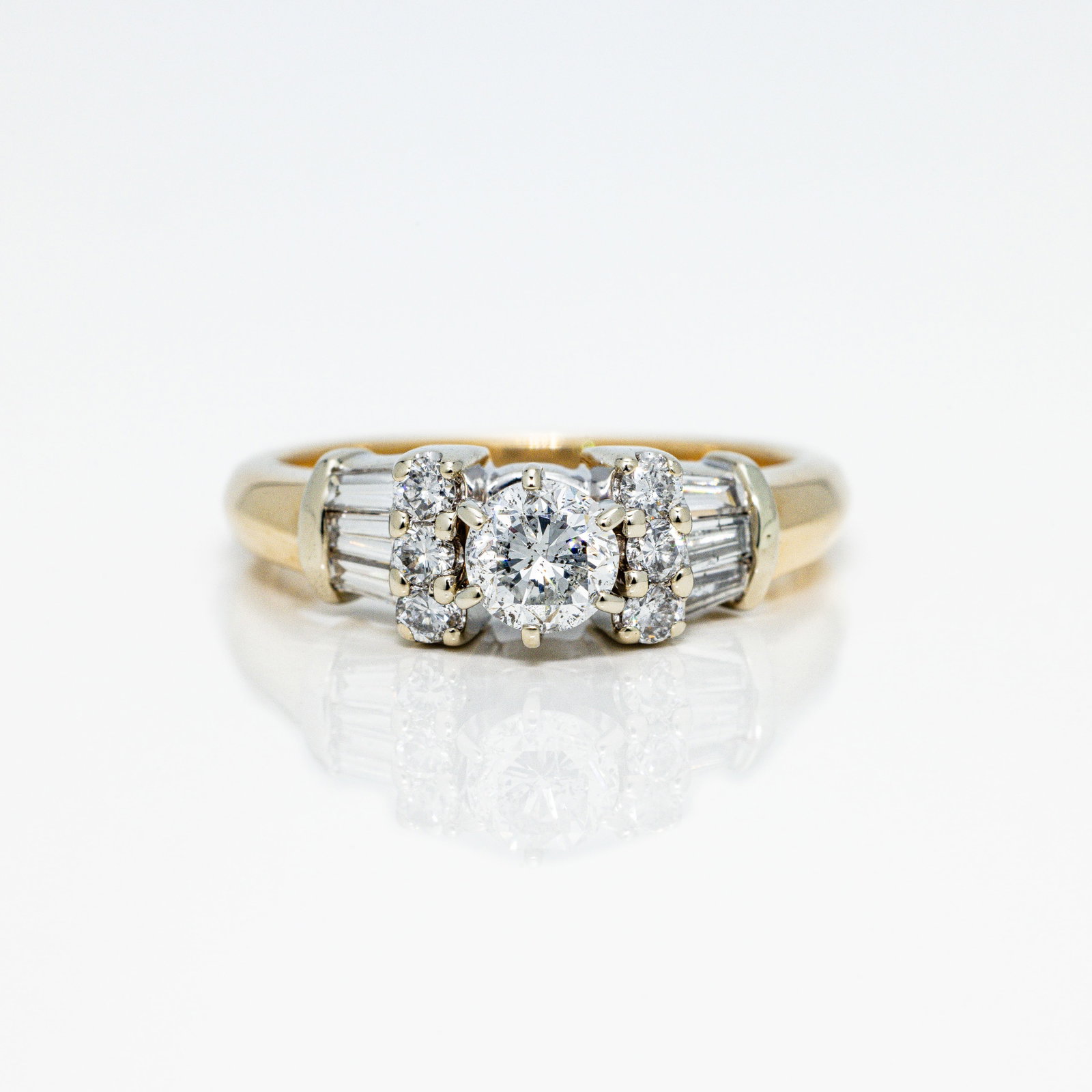 14kt Gold 1 ctw Natural Diamond Engagement Ring: Click or Tap For Video! A very nice engagement ring featuring an approx. .40 carat round diamond flanked by some gorgeous rounds and tapered baguettes. The ring is well ma