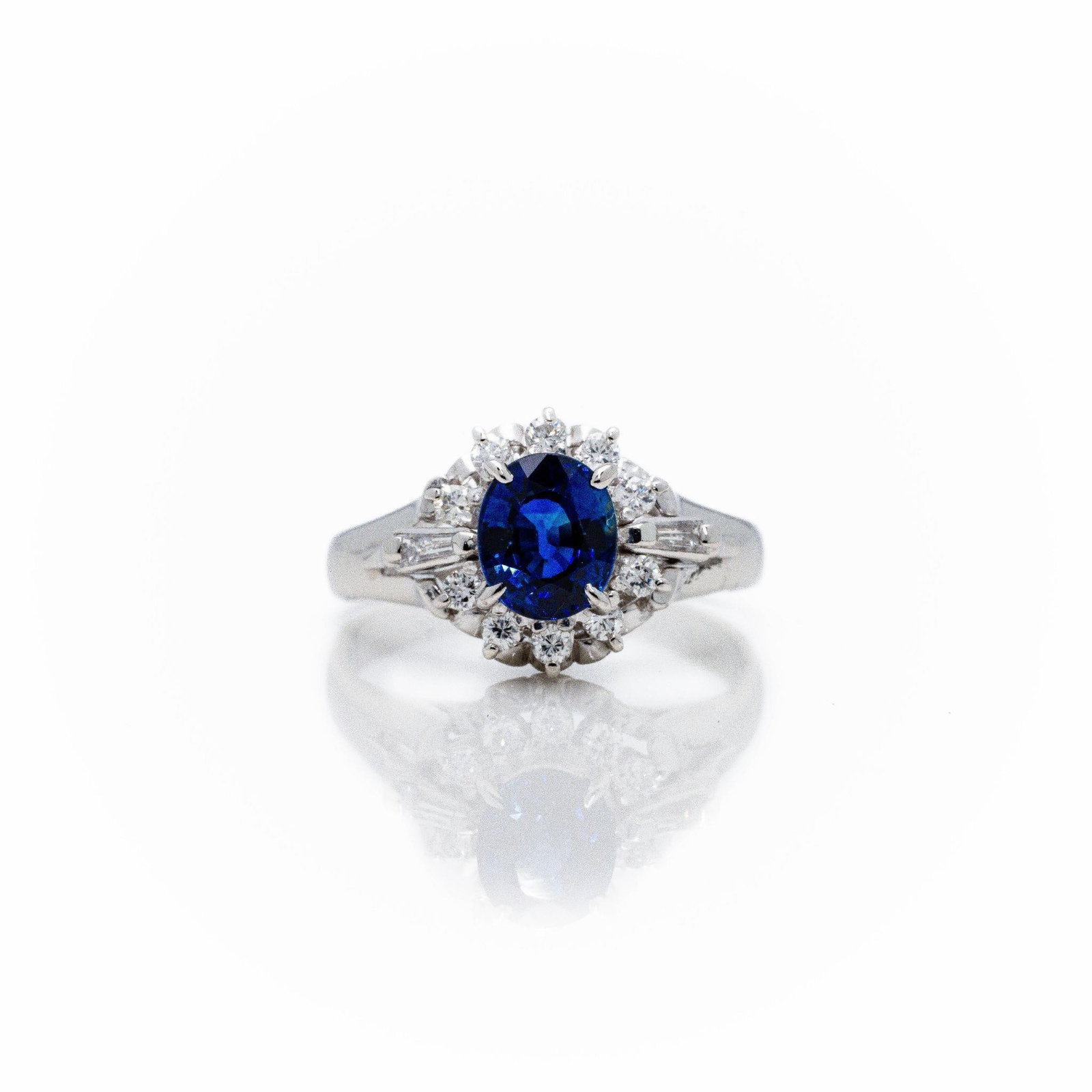 Antique Platinum Ceylon Sapphire Diamond Halo Ring: A very fine antique ring featuring a natural Ceylon sapphire center in oval shape, .96 carat with a deep blue color. ATTENTION- Hannosh's will gladly offer more videos and pictures of this lot by text
