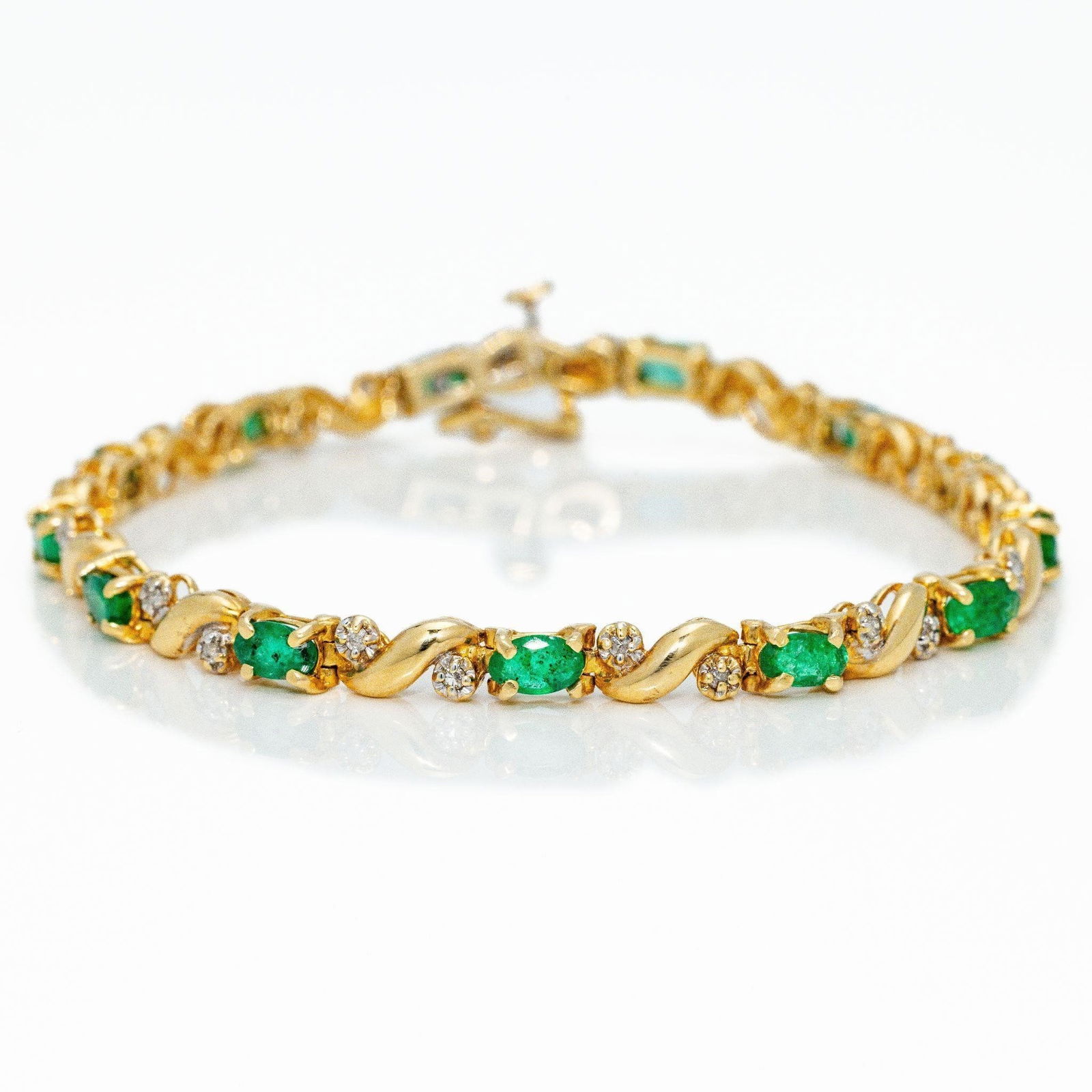 14kt Gold 4.26 ctw Emerald Diamond Tennis Bracelet: A classic tennis bracelet styler with a uniform setting of oval shaped green emeralds and fine white diamonds. ATTENTION- Hannosh's will gladly offer more videos and pictures of this lot by texting 58