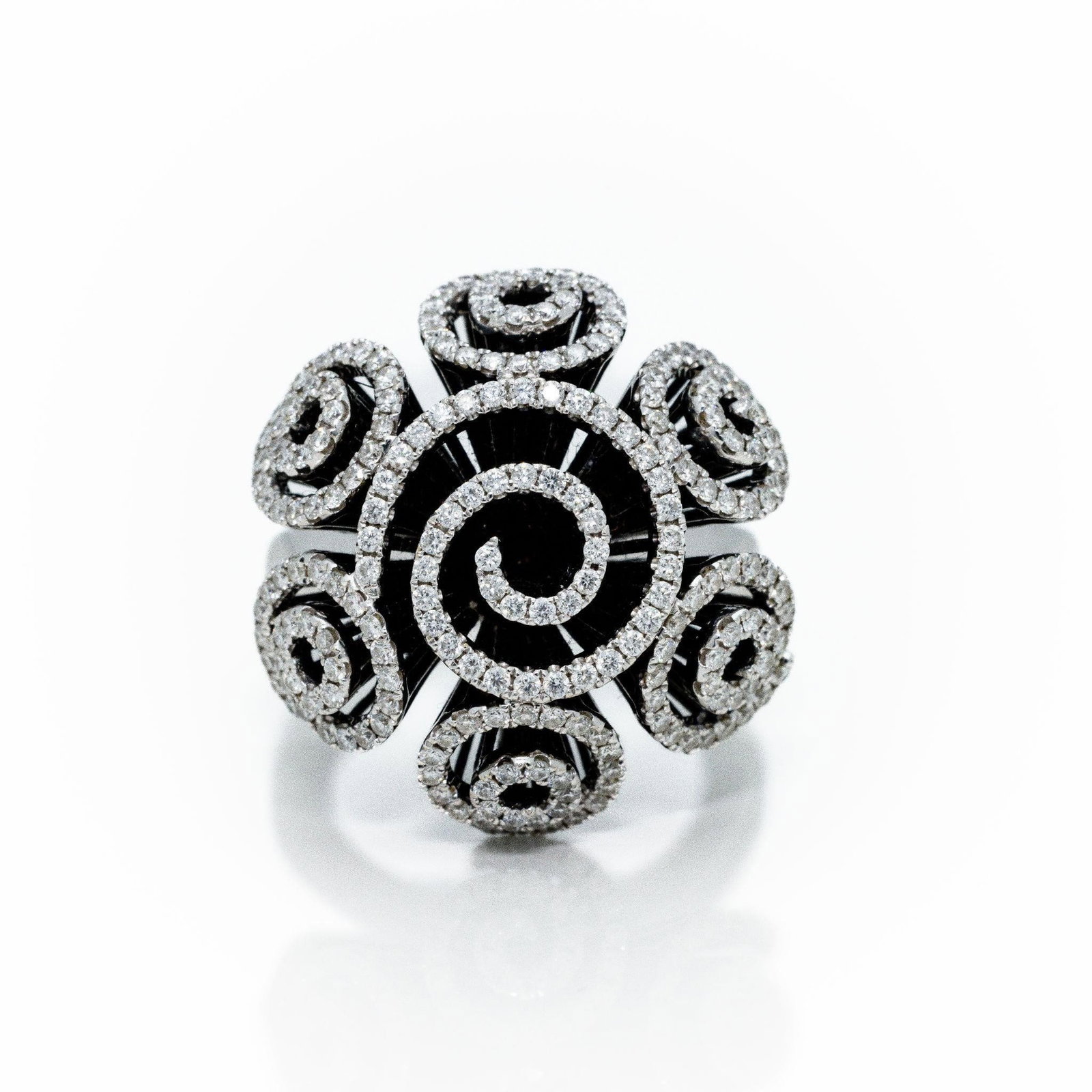 18kt White Gold Diamond Swirl Floral Bouquet Ring: An extremely fine and intricate diamond ring featuring a very large look. Perfect for anyone seeking a statement in high fashion. This ring was made by JPM New York. ATTENTION- Hannosh's will gladly o