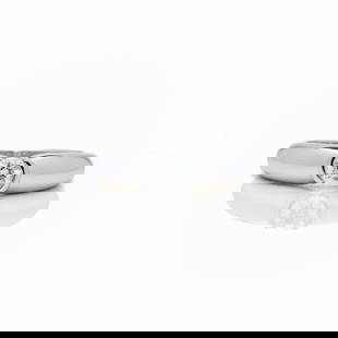 Cartier 18k WG Round Bezel Diamond Solitaire Ring: Cartier 18k White Gold Solitaire Ring - 0.27ct E/VVS Diamond - Signed - 1996 - Size 5 This is a 100% authentic Cartier diamond ring, crafted in solid 18k white gold and featuring a stunning 0.27