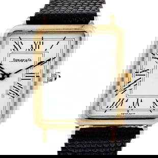 Tiffany & Co 14KT Yellow Gold Quartz Wristwatch: Tiffany & Co. 14kt Yellow Gold Quartz - Rectangular Roman Dial - Black Lizard Strap A sleek and elegant Tiffany & Co. wristwatch crafted in solid 14kt yellow gold. This vintage piece features a refine