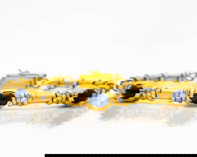 18k Yellow Gold Cabochon Sapphire Diamond Bracelet: 18K Yellow Gold Sapphire & Diamond Bangle - 30.13g - Part of Matching Set This vintage open bangle bracelet is crafted from solid 18K yellow gold and features three richly colored cabochon-cut nat