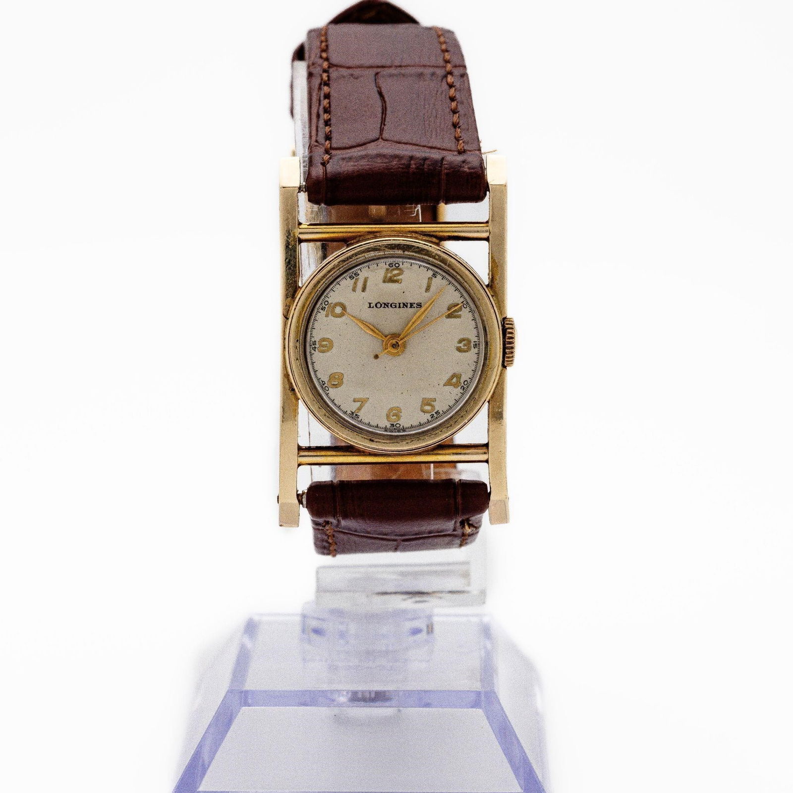 Vintage Longines Mainliner Manual Wind Watch: Longines "Mainliner" Rectangular Dress Watch - Caliber 8LN - 10 kt Gold-Filled Case - Circa 1950s An elegant artifact of postwar design, this Longines "Mainliner" captures the sleek minimalism and cra