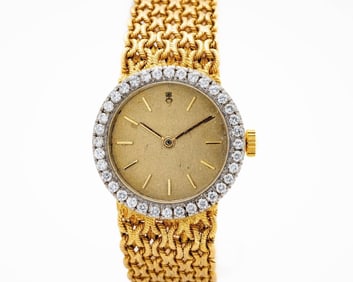 Vintage Corum 18kt Yellow Gold Diamond Bezel Watch
