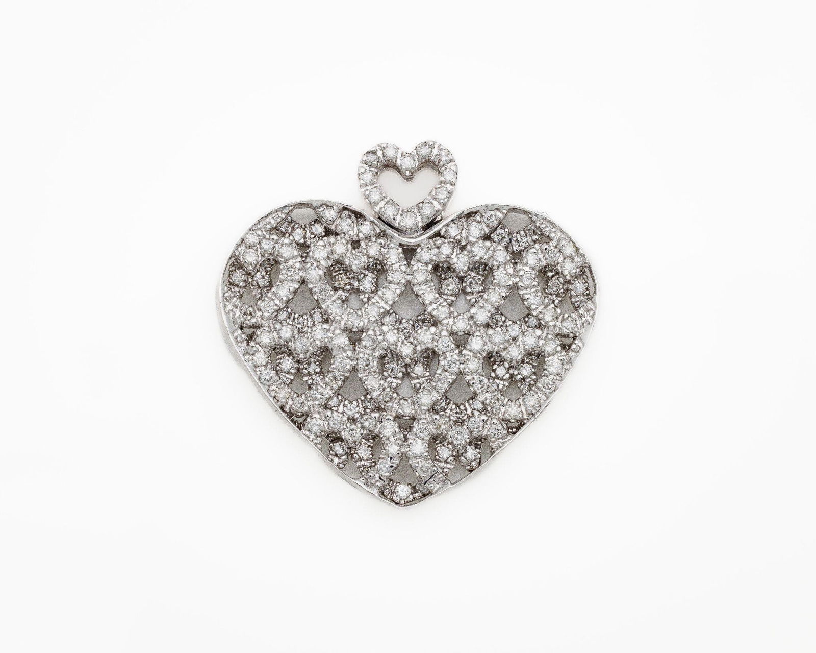 Vintage 14kt White Gold 2ctw Diamond Heart Pendant: Antique 14kt White Gold 2ctw Diamond Heart Pendant A bold and romantic Antique inspired pendant crafted in solid 14kt white gold. This heart-shaped design features two full layers of round prong-set d