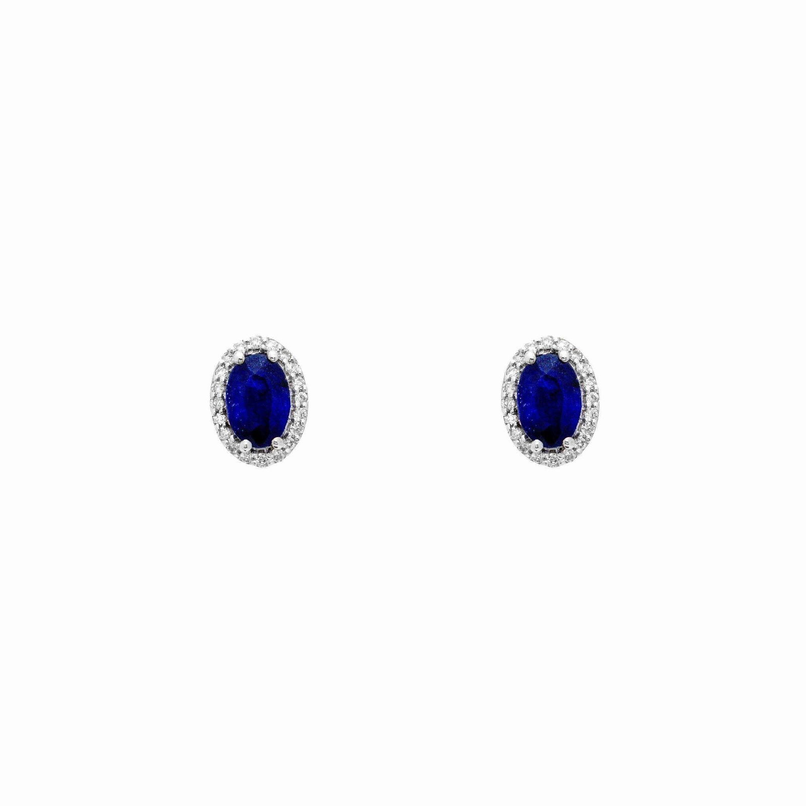 14kt Gold Natural Sapphire Halo Diamond Earrings: 14kt Gold Natural Sapphire Halo Diamond Earrings A refined pair of 14kt white gold stud earrings featuring natural oval-cut blue sapphires surrounded by halos of sparkling round diamonds. Each sapphir
