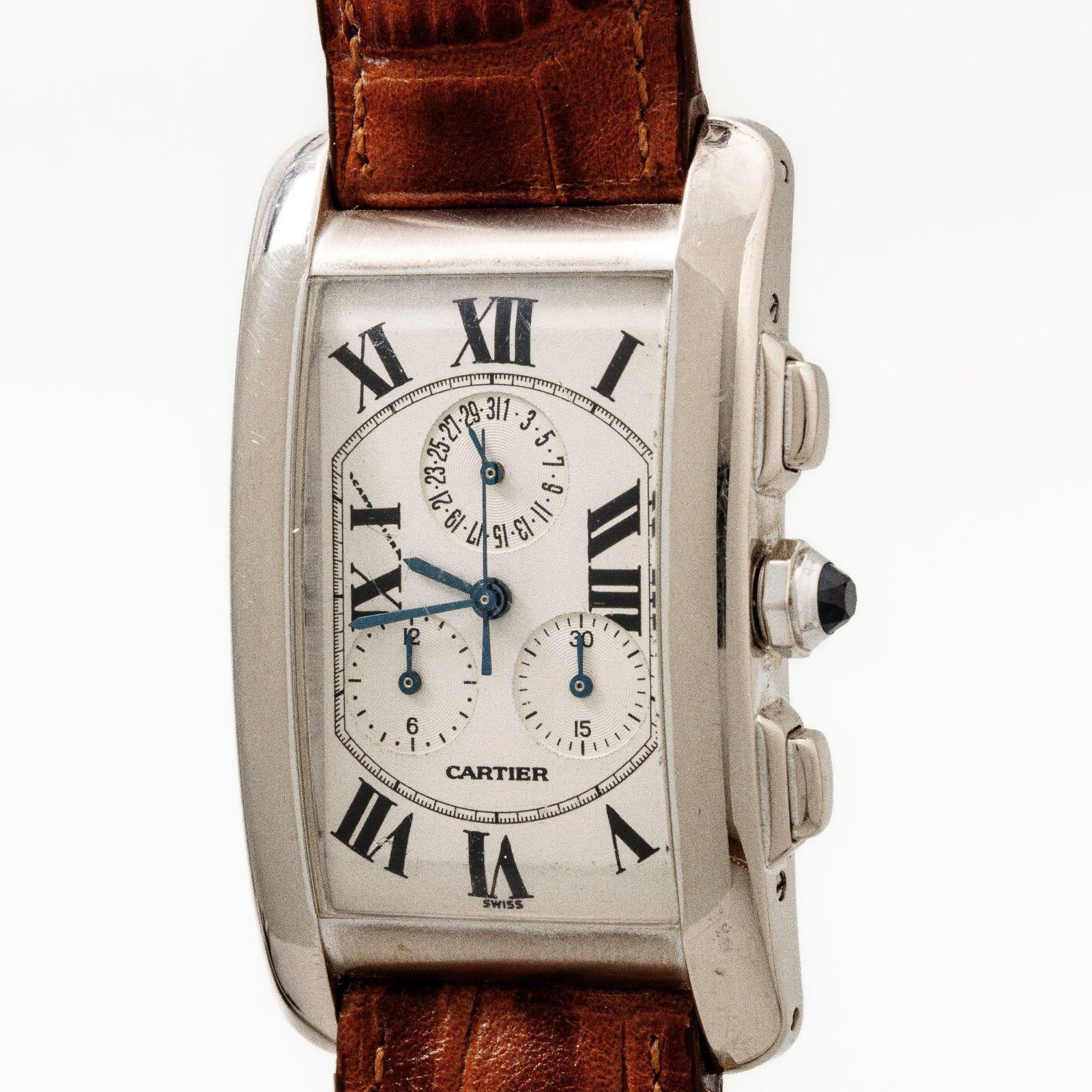 Cartier Tank Américaine 2312 18kt White Gold Watch: Brand: Cartier Model: Tank Americaine Chronograph Reference: 2312 Movement: Quartz chronograph (Cartier caliber; ETA-based) Functions: Hours · Minutes · Chronograph · Pointer Date Case Size: 45 x