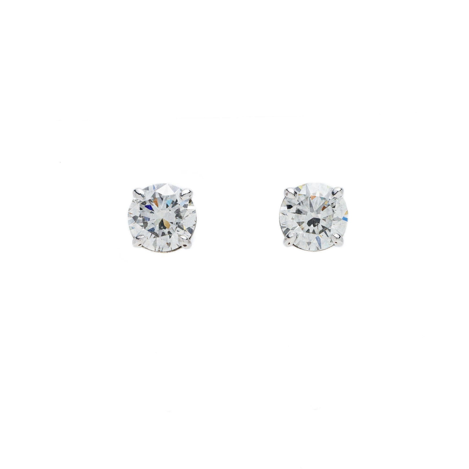 14kt White Gold 6 ctw Round Diamond Stud Earrings: A very fine pair of diamond stud earrings that are set in 4 prong settings in 14kt solid white gold. The diamonds are 3 carat each or 6 carats total weight. These MASSIVE earrings are custom made