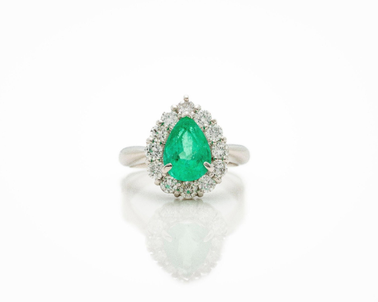 Platinum Natural Colombian Emerald Diamond Ring: Platinum Colombian Emerald & Diamond Ring - 2.05ct Pear Neon Green This extraordinary vintage ring is a rare and captivating treasure; centered around a 2.05ct natural Colombian emerald in a radiant