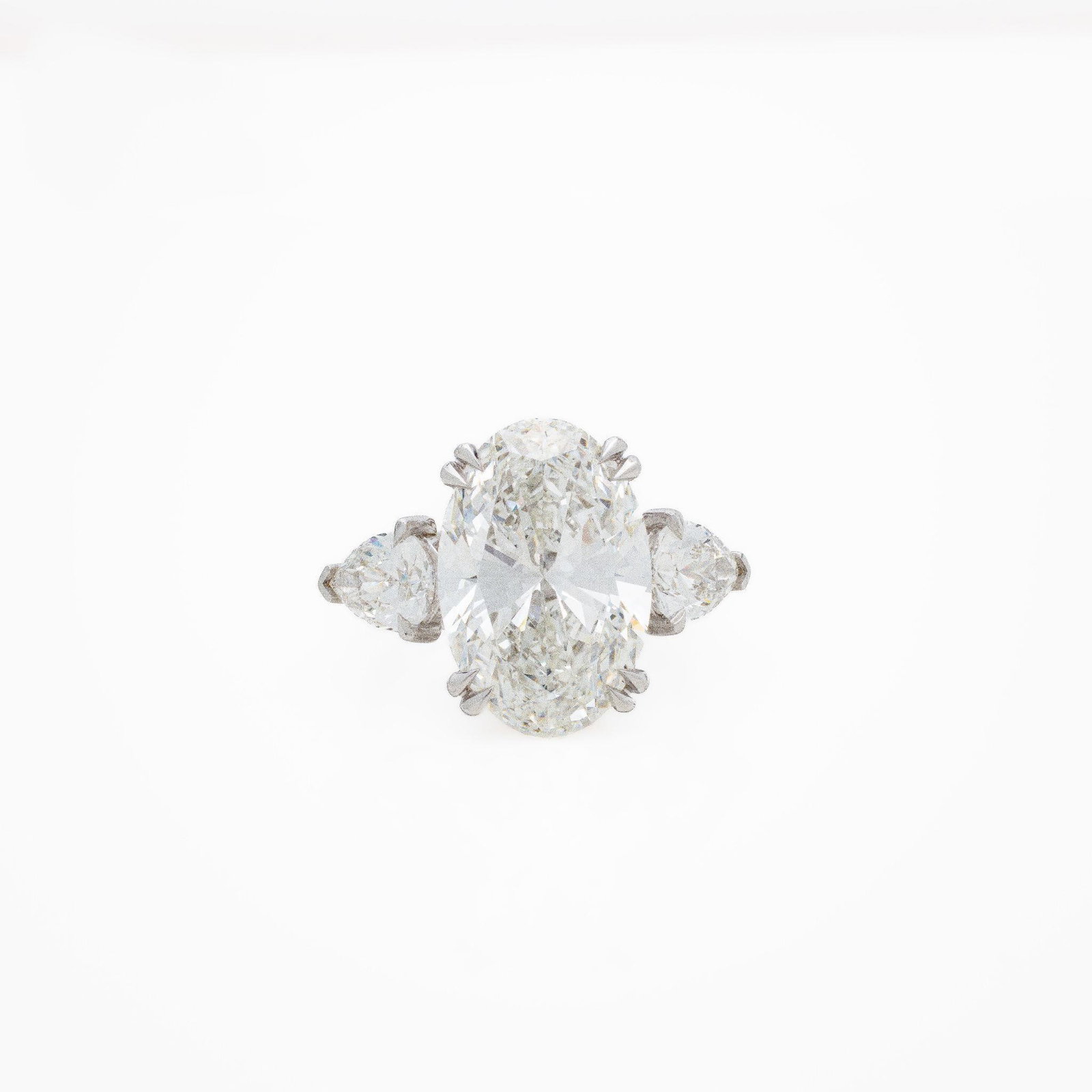 18kt White Gold 12.11 ctw Diamond Engagement Ring: 18K White Gold Three-Stone CVD Lab-Grown Diamond Ring · Oval Center · 12.11 ctw Total · IGI Certified A commanding and exceptionally well-executed three-stone diamond ring; crafted in solid 18kt