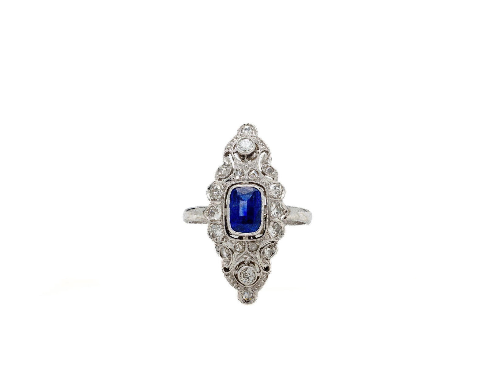 Vintage Platinum Sapphire and Diamond Shield Ring: Art Deco Platinum Open-Filigree Shield Ring 8 × 6 mm Emerald-Cut Natural Sapphire · Approx. 1.00 ctw Old-European-Cut Diamonds · Circa 1925 Hand-Fabricated Platinum · Architectural Deco Design · 