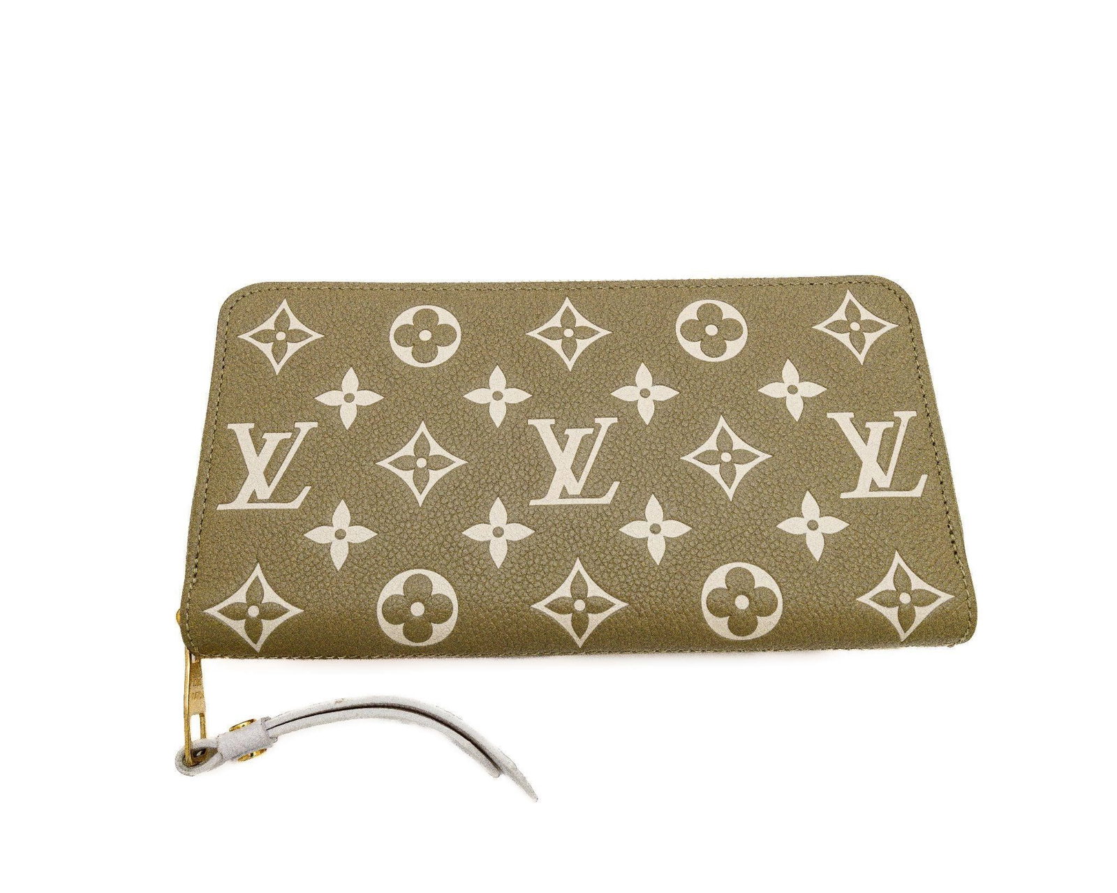 Louis Vuitton Zippy Wallet Monogram Empreinte: Louis Vuitton Zippy Wallet - Khaki Beige Monogram Empreinte Leather Model M81280 · Grained Cowhide Leather · Gold-Tone Hardware · Full Continental Design An elegant example of Louis Vuitton's timel