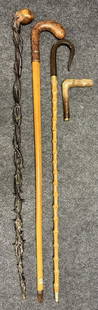 Lot 4 Antique Hand Carved Walking Stick Canes: Carved head camel. Thorny twig twist. Ladies walking stick w/ bakelite handle. Snake skin handled Clemente France marked cane. Longest 36"