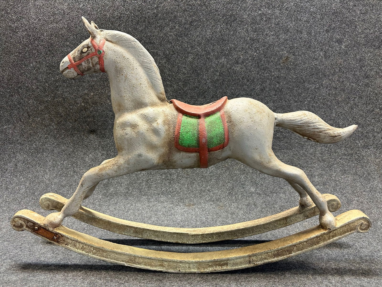 Antique Late 1800s Cast Iron Painted Figural Rocking Horse: Extremely heavy, weighing in at 75 lbs. 23" wide x 7" wide x 23" tall overall.