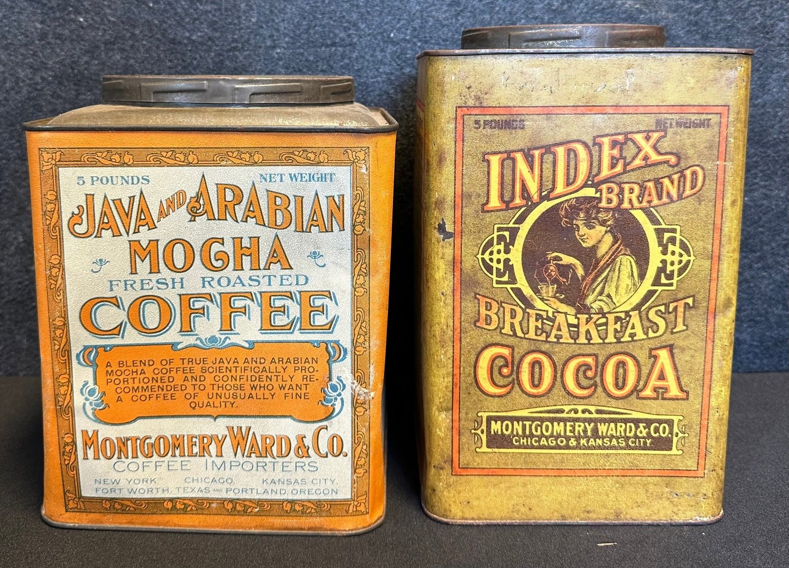 Pair Antique 1900s Mongtomery Ward Java & Arabian Mocha + Index Brand Breakfast Cocoa 5lb Tin Cans: Both are in great condition overall. Strong and vibrant colors.