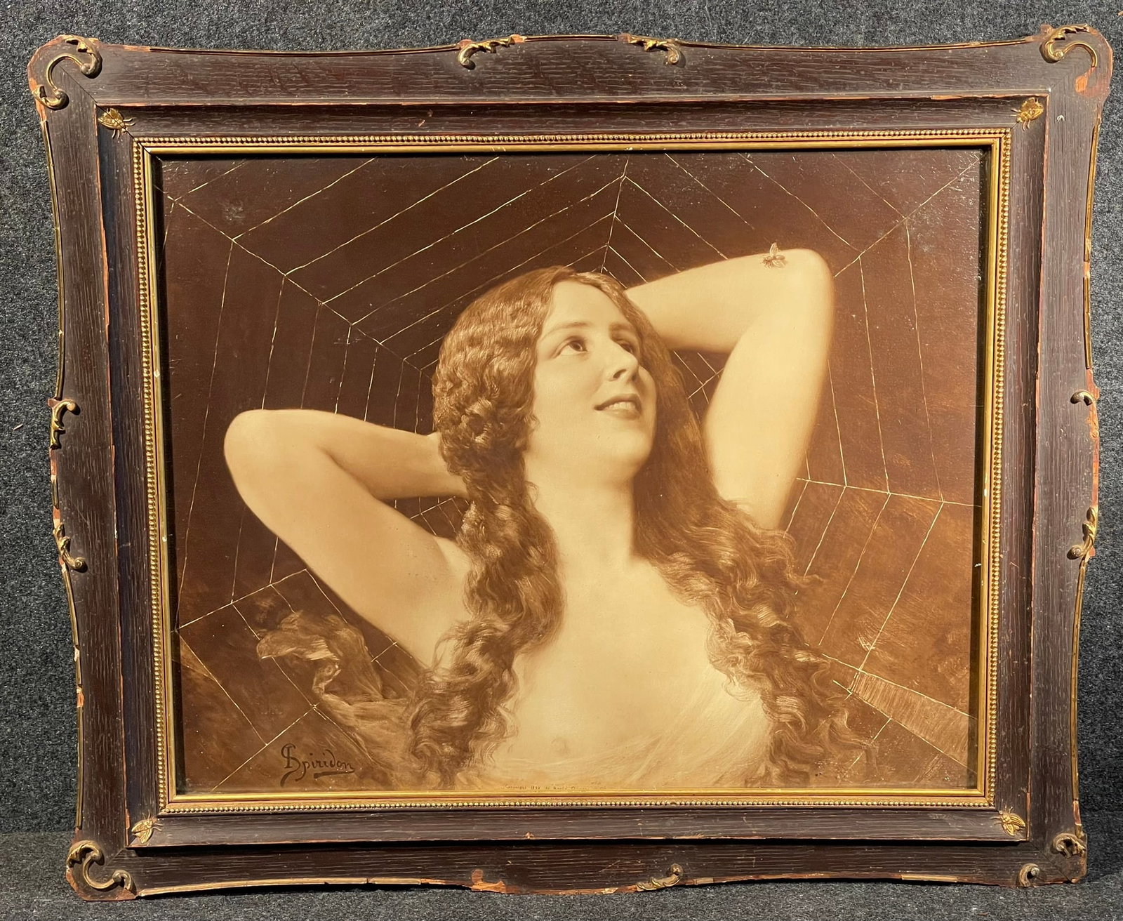 Braun Clement 1898 Risque Nude Woman Spider & The Fly by Ignace Spiridon w/ Original Carved Frame: Absolutely incredible late 19th century Ignace Spiridon copyright 1898 spider & the fly nude risque woman with original carved wooden frame w/ carved fly corner adornments. Overall measures 24" x 20" 