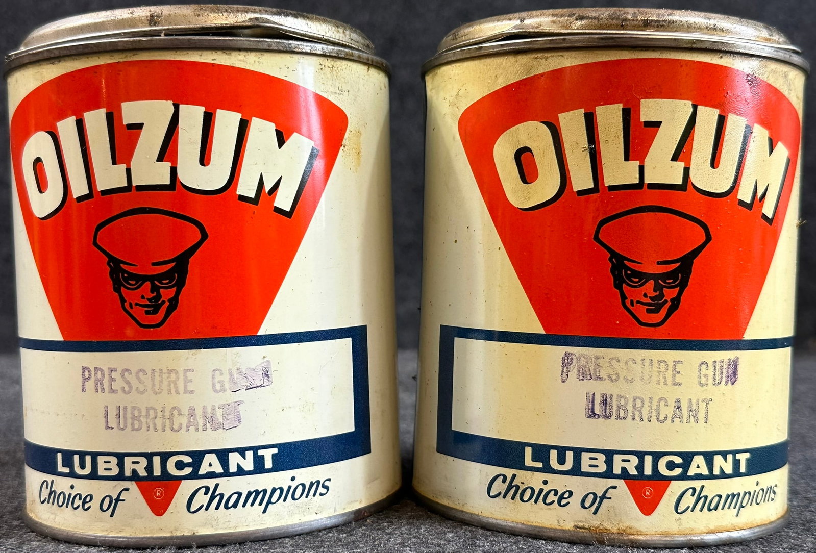 Pair Full NOS Oilzum 1950s 2LB Pressure Gun Lubricant Cans: 4.25" diameter x 5.5" tall - both are full new old stock out of a case - shipped full with contents