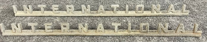 Pair 1950s Vintage International Script Automotive Emblems